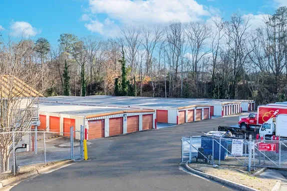 Outdoor self storage units within fenced facility with secure access gate